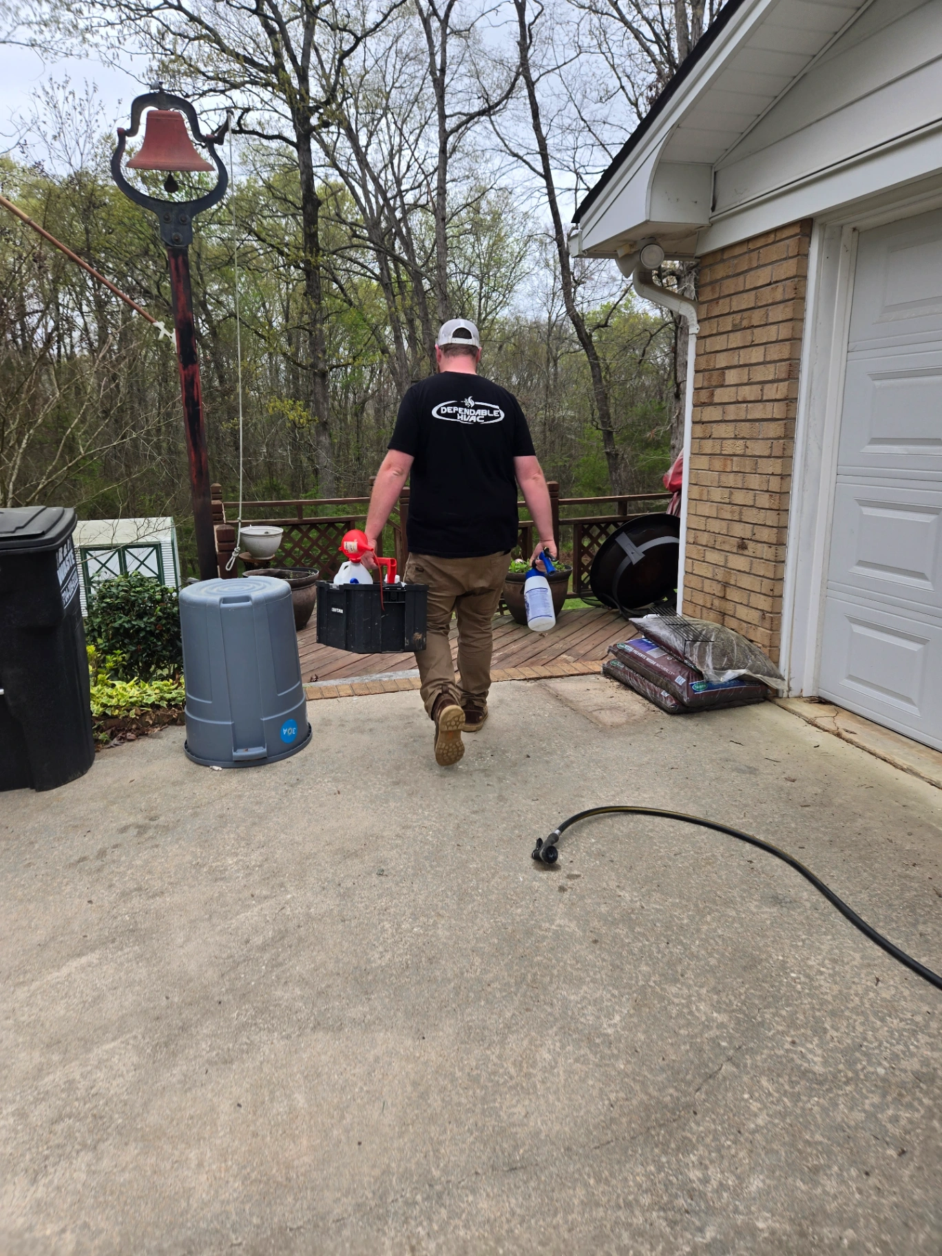 Dependable HVAC technician walking with tools ready for Pee Dee calls