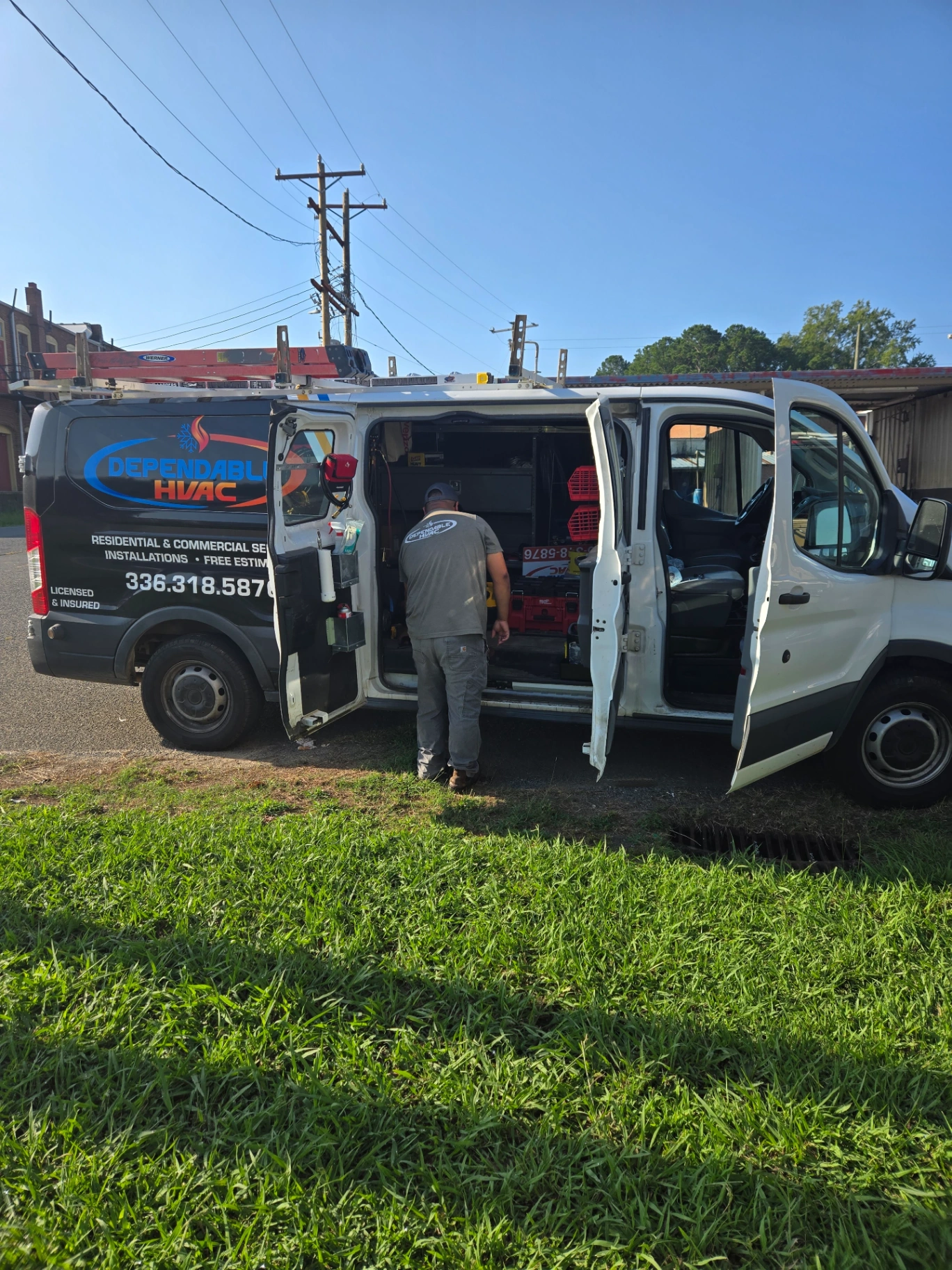 Dependable HVAC technician working from service van with professional equipment in Albemarle NC