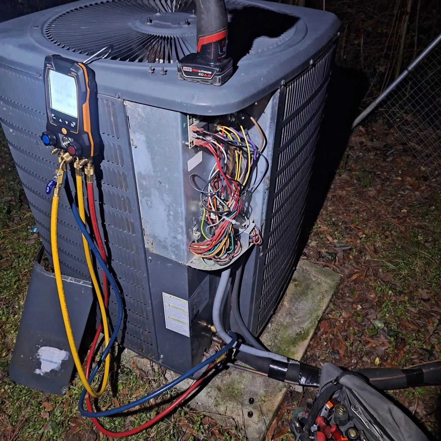 HVAC technician diagnosing heating system