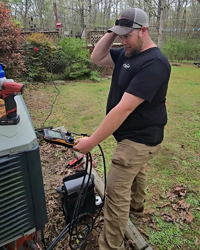 Dependable HVAC technician performing diagnostic service near Aquadale NC